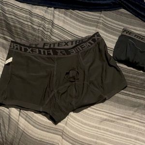Grey and black boxer briefs with a separate hole